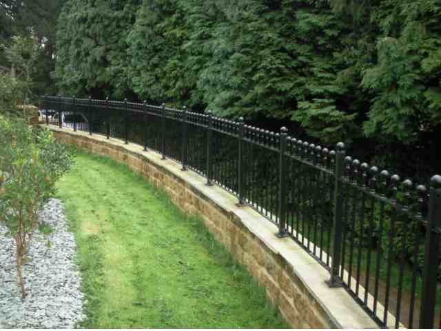 curved railings, rails that curve, wrought iron railings, rounded railings, railis in iron